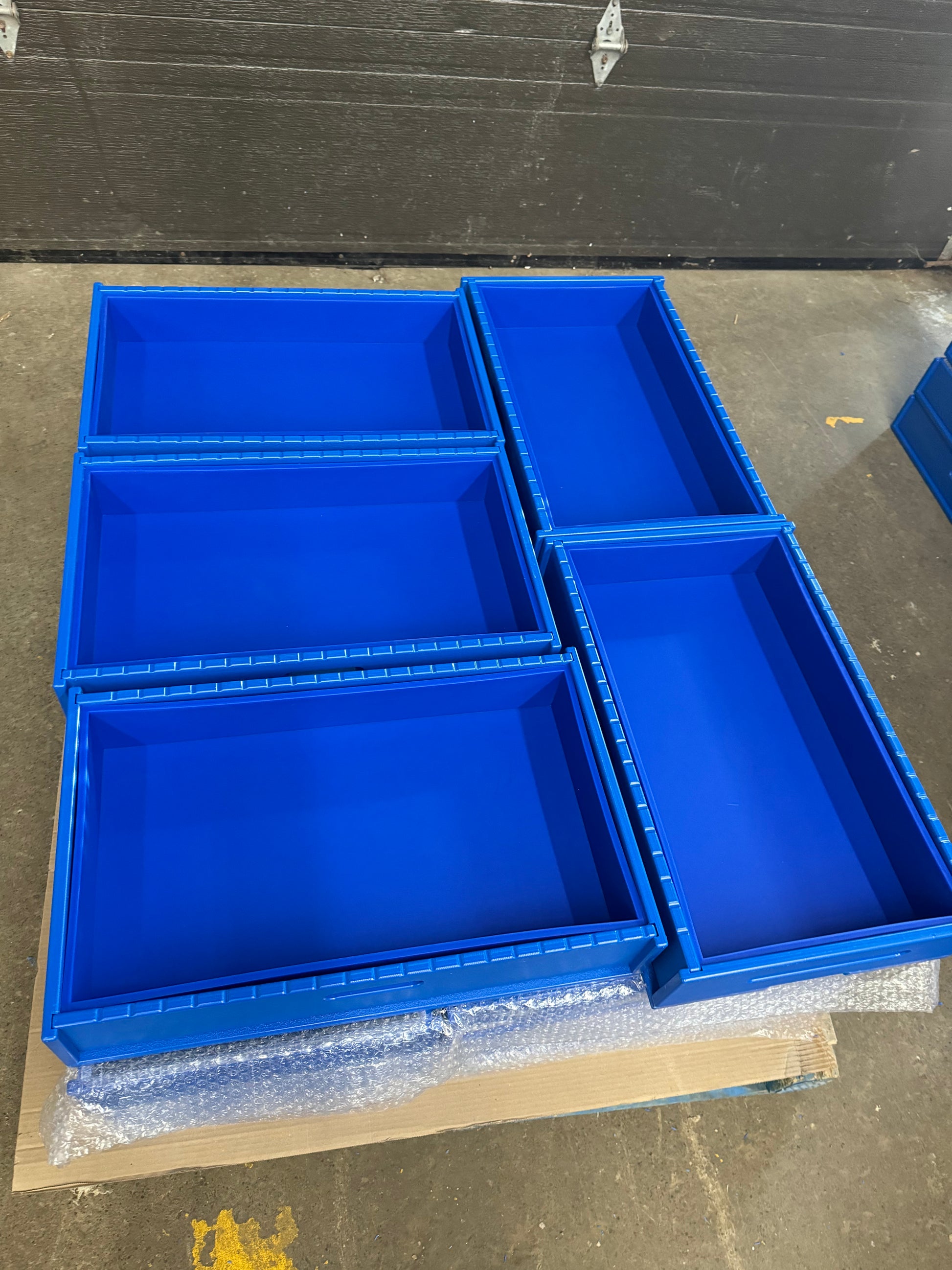 A set of blue HDPE soap molds arranged on a surface, designed for crafting bars of soap.