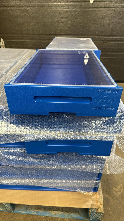 Stack of blue high density plastic soap mold  on a pallet.