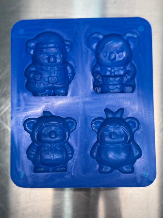 Blue silicone mold with koala shapes on a metallic surface